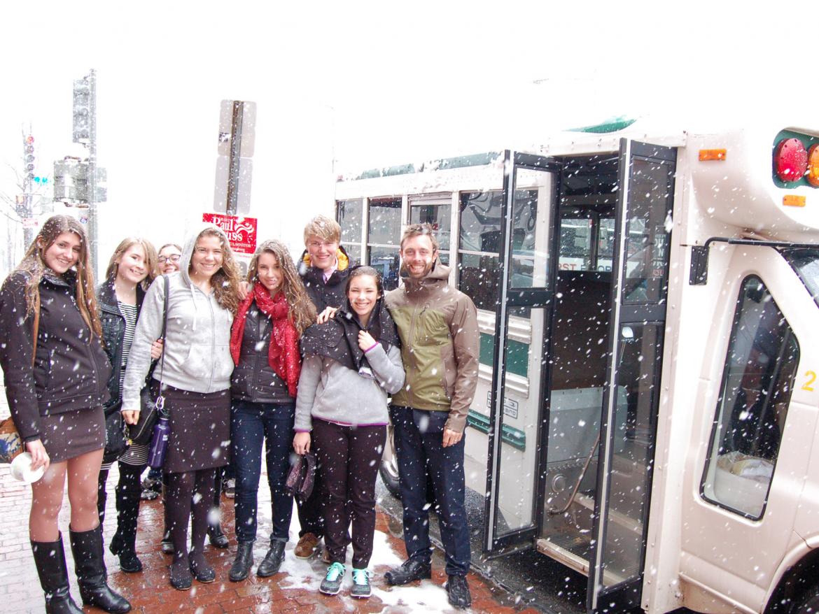 Students from Carolina Friends School board their bus