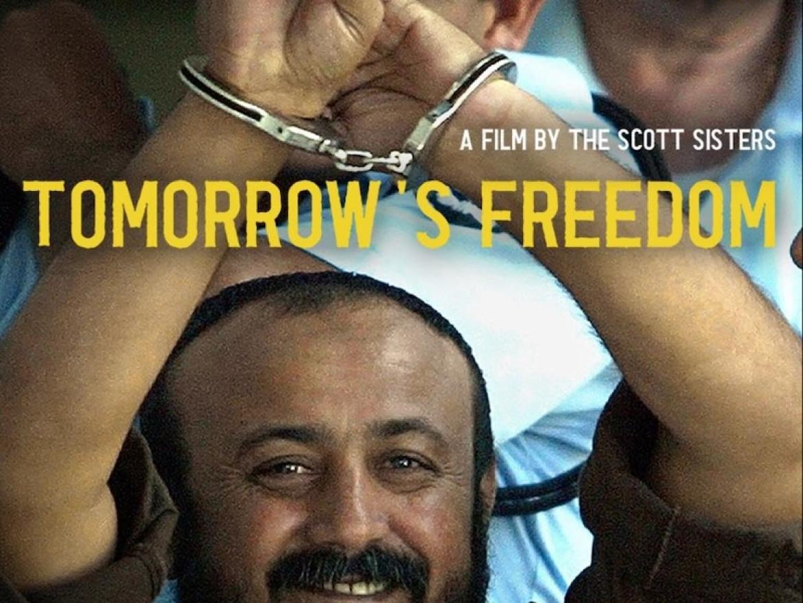 A film poster for Tomorrow's Freedom. The film title is printed on a photo of Marwan Barghouti holding his handcuffed hands over his head and making a peace sign with two fingers.
