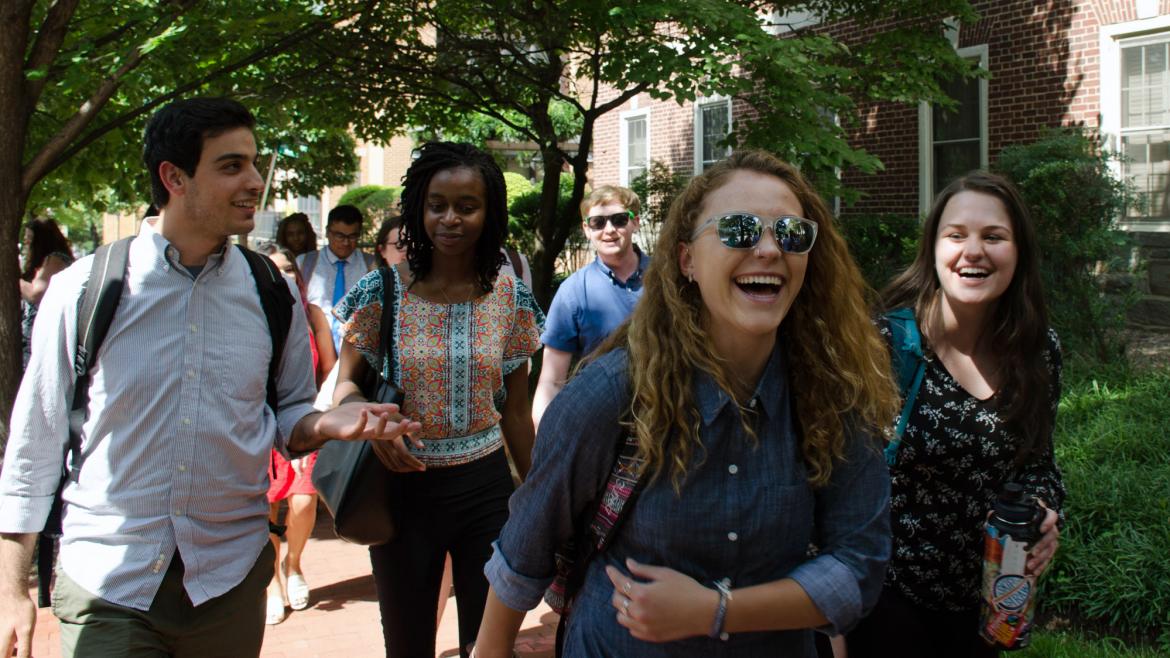 Students laughing and walking on Capitol Hill