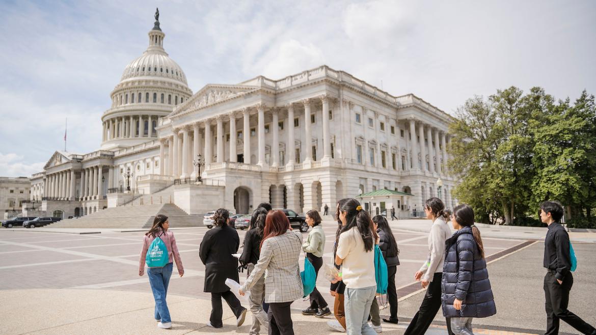 Group of young advocates walking toward the U.S. Captiol at FCNL's Spring Lobby Weekend